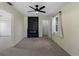 Bedroom with ceiling fan, a fireplace, and a view out a window at 3405 10Th W St, Palmetto, FL 34221