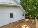Spacious wooden deck with access to the home, offering an ideal outdoor living space at 3405 10Th W St, Palmetto, FL 34221