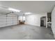Spacious garage interior with automatic door, storage shelves and side entry door at 3405 10Th W St, Palmetto, FL 34221