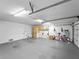 Large garage with ample space, storage cabinets, and additional wall storage at 3405 10Th W St, Palmetto, FL 34221