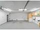 A spacious garage featuring white walls, ample lighting, and built-in storage cabinets at 3405 10Th W St, Palmetto, FL 34221