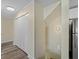 Hallway with hardwood floors, closet with panel doors, and staircase at 3405 10Th W St, Palmetto, FL 34221