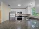 Beautiful kitchen features stainless steel appliances, granite countertops, and white cabinets at 3405 10Th W St, Palmetto, FL 34221