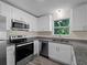 Charming kitchen with stainless appliances, granite counters, and bright natural light at 3405 10Th W St, Palmetto, FL 34221