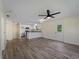 Bright and airy living room featuring modern flooring and a ceiling fan at 3405 10Th W St, Palmetto, FL 34221