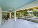 Open patio with tiled floor, ceiling fans, and views of the landscaped backyard at 3405 10Th W St, Palmetto, FL 34221