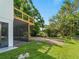 Exterior view of a home highlighting its yard, landscaping, and outdoor space at 3405 10Th W St, Palmetto, FL 34221