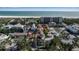 Aerial view showing the house among surrounding houses near a beach at 436 Canal Rd # A, Sarasota, FL 34242