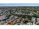Aerial view of neighborhood featuring tile roofed homes near a canal, surrounded by green foliage at 436 Canal Rd # A, Sarasota, FL 34242