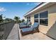Balcony featuring four wicker lounge chairs and a wonderful view at 436 Canal Rd # A, Sarasota, FL 34242