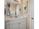 Well-lit bathroom featuring a vanity with mirror and attractive decor at 436 Canal Rd # A, Sarasota, FL 34242