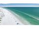 Aerial view of a beautiful white sand beach with turquoise water, showcasing a peaceful coastal lifestyle at 436 Canal Rd # A, Sarasota, FL 34242