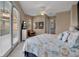 Inviting bedroom with neutral tones, a ceiling fan, and access to a private balcony at 436 Canal Rd # A, Sarasota, FL 34242