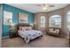 Comfortable bedroom featuring soft carpet, complemented by an ocean-themed motif and natural light at 436 Canal Rd # A, Sarasota, FL 34242