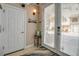 Inviting entryway with tile flooring, coat closet, and a beach-themed decor, welcoming you into this lovely home at 436 Canal Rd # A, Sarasota, FL 34242