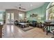 Open living room with stylish decor, comfortable seating, and access to the outdoors through glass doors at 436 Canal Rd # A, Sarasota, FL 34242