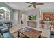 Open floor plan with tile floors, bar stool seating, and a large television for modern living and entertaining at 436 Canal Rd # A, Sarasota, FL 34242