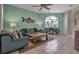 Inviting living room with comfortable couches, stylish decor, and tiled floors for a relaxed coastal vibe at 436 Canal Rd # A, Sarasota, FL 34242
