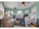 Bright living room with tiled floor, ceiling fans, and twin beds perfect for relaxing at 436 Canal Rd # A, Sarasota, FL 34242