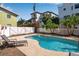 Backyard pool surrounded by a privacy fence and tropical landscaping, creating a private outdoor retreat at 436 Canal Rd # A, Sarasota, FL 34242