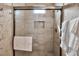Modern tiled shower featuring a glass door, built-in niche, and stylish fixtures at 436 Canal Rd # A, Sarasota, FL 34242