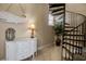 Elegant stairwell with a wrought iron spiral staircase and a view at 436 Canal Rd # A, Sarasota, FL 34242