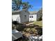 Backyard view featuring a grassy area, mature trees and privacy, great for outdoor living at 4704 Winchester Dr, Sarasota, FL 34234