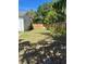 Large fenced backyard with mature landscaping provides a private outdoor space at 4704 Winchester Dr, Sarasota, FL 34234