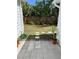 Backyard patio with garden, stepping stone path, and mature landscaping providing privacy at 4704 Winchester Dr, Sarasota, FL 34234