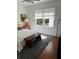 Bright bedroom with white walls, large windows, and hardwood floors, creating a serene retreat at 4704 Winchester Dr, Sarasota, FL 34234