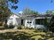 Charming single-story home with a well-maintained lawn, and a inviting porch with wrought iron accents at 4704 Winchester Dr, Sarasota, FL 34234