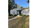 Charming single-story home with a well-maintained lawn, and a inviting porch with wrought iron accents at 4704 Winchester Dr, Sarasota, FL 34234