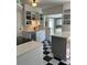Well-designed kitchen with stainless steel appliances, ample countertops, and stylish checkered floors at 4704 Winchester Dr, Sarasota, FL 34234