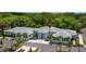 Aerial view of a community center surrounded by trees and landscaping, offering many amenities at 4861 Waterbridge Down, Sarasota, FL 34235