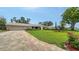 Charming single-story home featuring a well-manicured lawn and brick paved driveway at 4861 Waterbridge Down, Sarasota, FL 34235