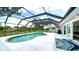 Enclosed pool with spacious deck and scenic backyard view at 4861 Waterbridge Down, Sarasota, FL 34235