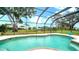 Enjoy this beautiful private pool with screened-in lanai and serene backyard at 4861 Waterbridge Down, Sarasota, FL 34235