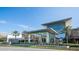 Exterior view of University Town Center Mall, featuring modern architecture and palm tree landscaping at 4861 Waterbridge Down, Sarasota, FL 34235