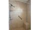Updated bathroom shower featuring tiled walls, a built-in seat, and modern fixtures at 5057 Live Oak Cir # 86, Bradenton, FL 34207