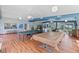 Spacious clubhouse featuring a kitchen, ping pong table, pool table and seating, perfect for community gatherings and entertainment at 5057 Live Oak Cir # 86, Bradenton, FL 34207