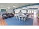 Large clubhouse interior with a comfy sofa, dining tables, and bookshelves, creating a welcoming space for social activities at 5057 Live Oak Cir # 86, Bradenton, FL 34207