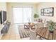 Bright living room featuring neutral tones, contemporary furnishings, and access to a screened lanai at 5057 Live Oak Cir # 86, Bradenton, FL 34207