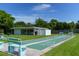 Enjoy a game of shuffleboard on the community court, surrounded by lush greenery and a clear blue sky at 5057 Live Oak Cir # 86, Bradenton, FL 34207