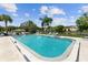 Inviting community swimming pool with lounge chairs and well-maintained landscaping at 5057 Live Oak Cir # 86, Bradenton, FL 34207