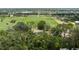An elevated aerial view of home among large green acreage at 5403 Red Rooster Rd, Parrish, FL 34219