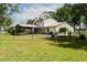 Spacious backyard enclosed by a black chain link fence, offering privacy at 5403 Red Rooster Rd, Parrish, FL 34219
