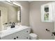 Well-lit bathroom with white vanity, modern fixtures, and neutral tones providing a clean and fresh aesthetic at 5403 Red Rooster Rd, Parrish, FL 34219