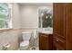 Bathroom with stylish vanity, tiled wall accents, and a well-lit mirror for a polished look at 5403 Red Rooster Rd, Parrish, FL 34219