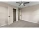This bedroom features neutral walls, carpet flooring, a ceiling fan, and a closet with white doors at 5403 Red Rooster Rd, Parrish, FL 34219