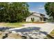 Exterior view of a modern two-story home with attached garage, fenced yard and long driveway at 5403 Red Rooster Rd, Parrish, FL 34219